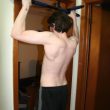 Young Guy Struggle Doing Pull-Up on Doorway Bar