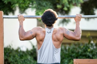 Man Doing Pull-Up on Grey Pull Up Bar Outdoor