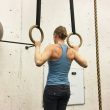 Woman Doing A Pull-Up in Rings