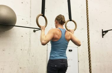 Woman Doing A Pull-Up in Rings